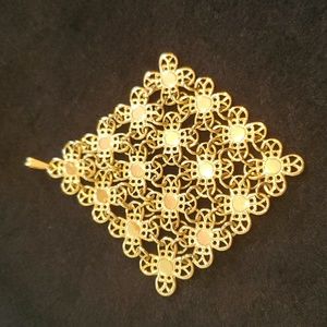 Gold tone necklace pendant